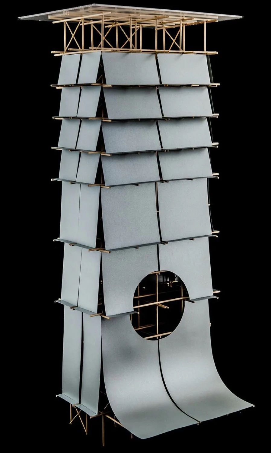 Model of a tower wrapped in spaced metallic panels over a timber frame